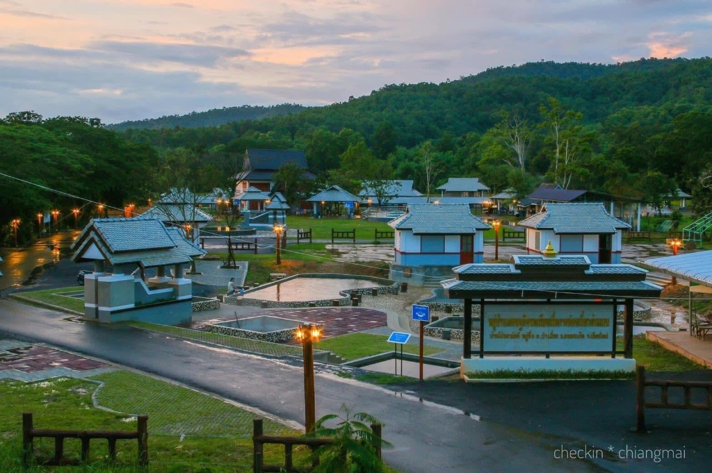 Twilight view over the Doi Saket Hot Spring pavilions with warm glowing lamps