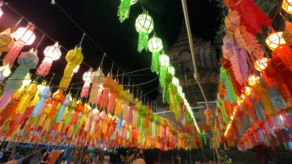 Vibrant hanging Lanna lanterns at temple night