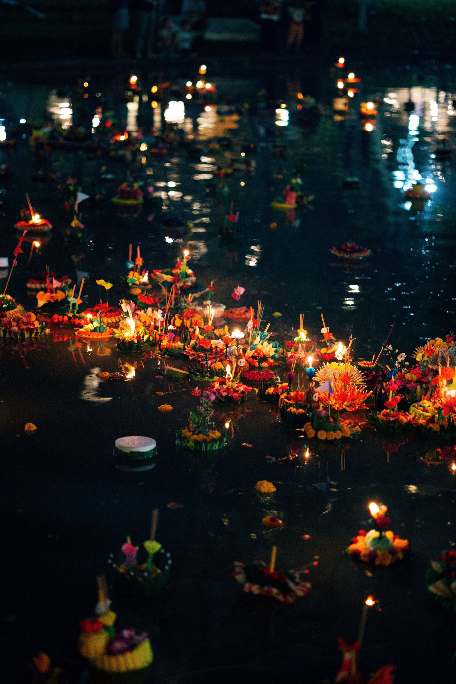 Floating candle-lit Krathongs on the river